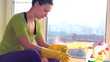Women cleaning a window