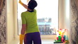 Women cleaning a window