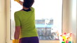 Women cleaning a window