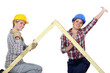 Peppy tradeswomen holding up a wooden frame