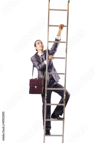 Photo: Businessman climbing the ladder isolated on white Businessman climbing the ladder isolated on white