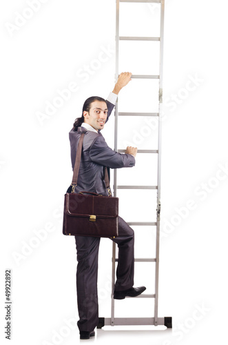 Photo: Businessman climbing the ladder isolated on white Businessman climbing the ladder isolated on white