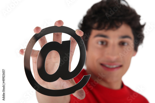 Photo: Man holding at symbol Man holding at symbol