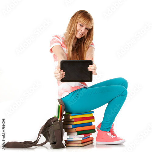 Photo: Young girl with books. Isolated on white background Young girl with books. Isolated on white background