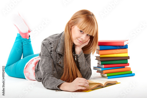 Photo: Young girl with books. Isolated on white background Young girl with books. Isolated on white background