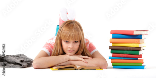 Photo: Young girl with books. Isolated on white background Young girl with books. Isolated on white background