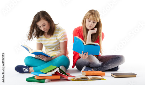 Photo: Two Teenage Girls reading The Book.Education Two Teenage Girls reading The Book.Education