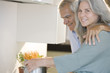 Mature couple cooking spaghetti