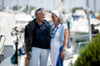 Mature couple enjoying a stroll at a marina