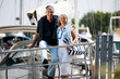 Mature couple enjoying a stroll at a marina