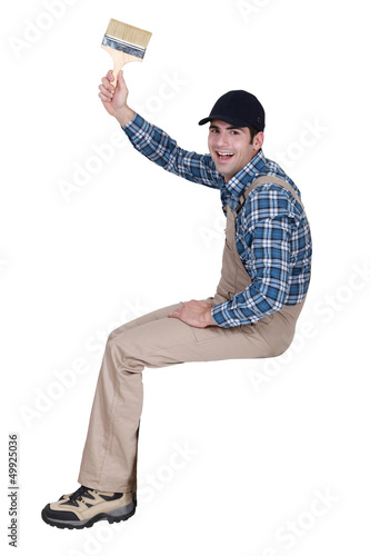 Photo: happy painter holding brush happy painter holding brush