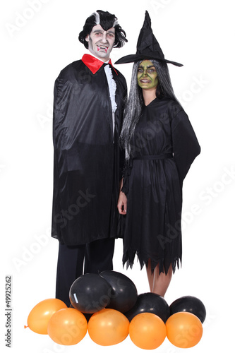 Photo: Couple disguised in vampire and witch Couple disguised in vampire and witch