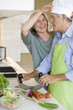 Mature couple preparing food