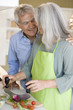 Mature couple preparing food