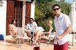 Friends having a barbecue on a sunny day