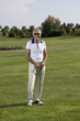 Mature man playing golf