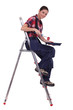 Woman sat on ladder with paint roller