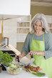 Mature woman preparing food
