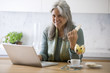 Mature woman with laptop computer