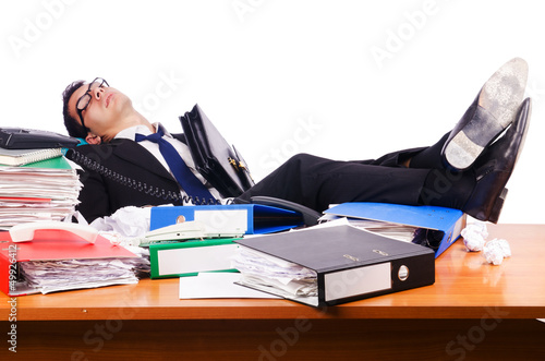 Photo: Young busy businessman at his desk Young busy businessman at his desk
