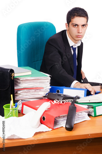 Photo: Young busy businessman at his desk Young busy businessman at his desk