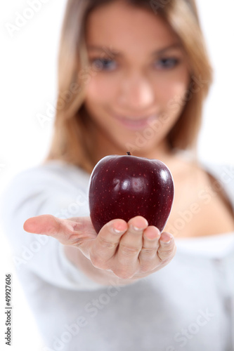 Photo: portrait of a woman holding an apple portrait of a woman holding an apple