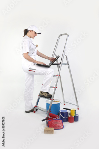Photo: Female decorator with a laptop Female decorator with a laptop