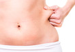 female pinching skin of her hip