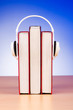 Concept of audio books with earphones on white