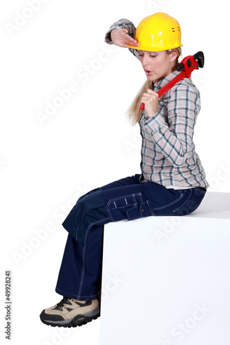 Photo: Tired female construction worker Tired female construction worker