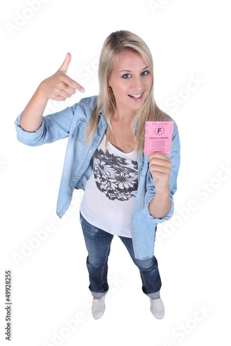 Photo: Blond teenager with driving license Blond teenager with driving license