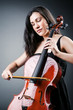 Woman cellist performing with cello