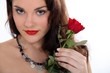 Brunette with a red rose