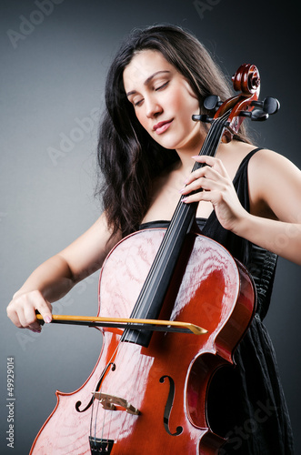 Photo: Woman cellist performing with cello Woman cellist performing with cello