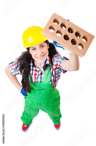 Photo: Woman builder with bricks on white Woman builder with bricks on white