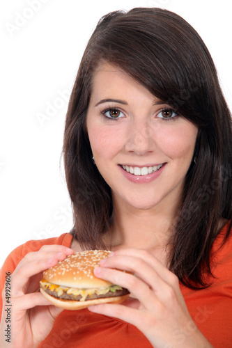 Photo: Girl eating hamburger Girl eating hamburger
