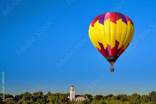 Photo: Deep blue sky with a hot air balloon and Boise Idaho train depot Deep blue sky with a hot air balloon and Boise Idaho train depot
