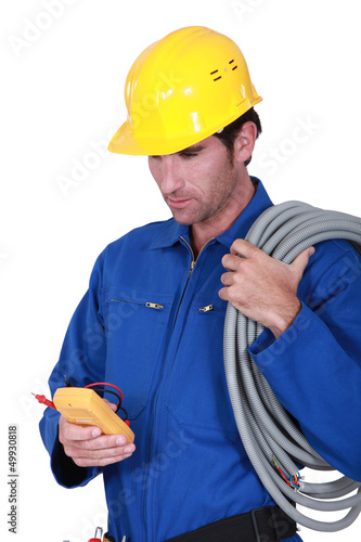 Photo: Electrician with voltmeter Electrician with voltmeter