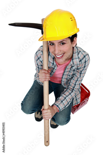 Photo: High-angle shot of a tradeswoman holding a pickaxe High-angle shot of a tradeswoman holding a pickaxe