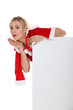 Blond woman dressed in Christmas outfit