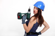 Woman with a power drill
