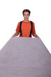 A man laying carpet.