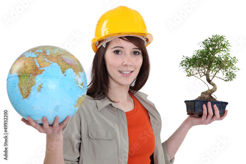 Photo: Woman with globe and bonsai Woman with globe and bonsai