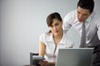employee at her desk with colleague