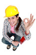 Tradeswoman giving the a-ok sign