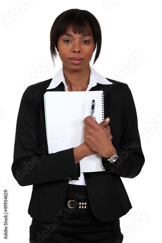 Photo: Young businesswoman with a notepad Young businesswoman with a notepad