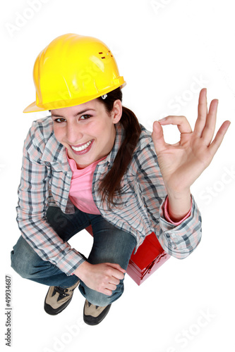 Photo: Tradeswoman giving the a-ok sign Tradeswoman giving the a-ok sign