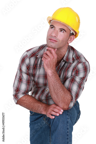 Photo: Tradesman with a dreamy look on his face Tradesman with a dreamy look on his face