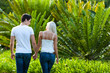 Couple enjoying romantic walk in park.