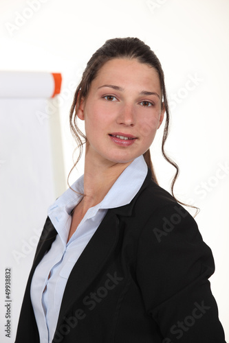 Photo: A businesswoman giving a presentation. A businesswoman giving a presentation.